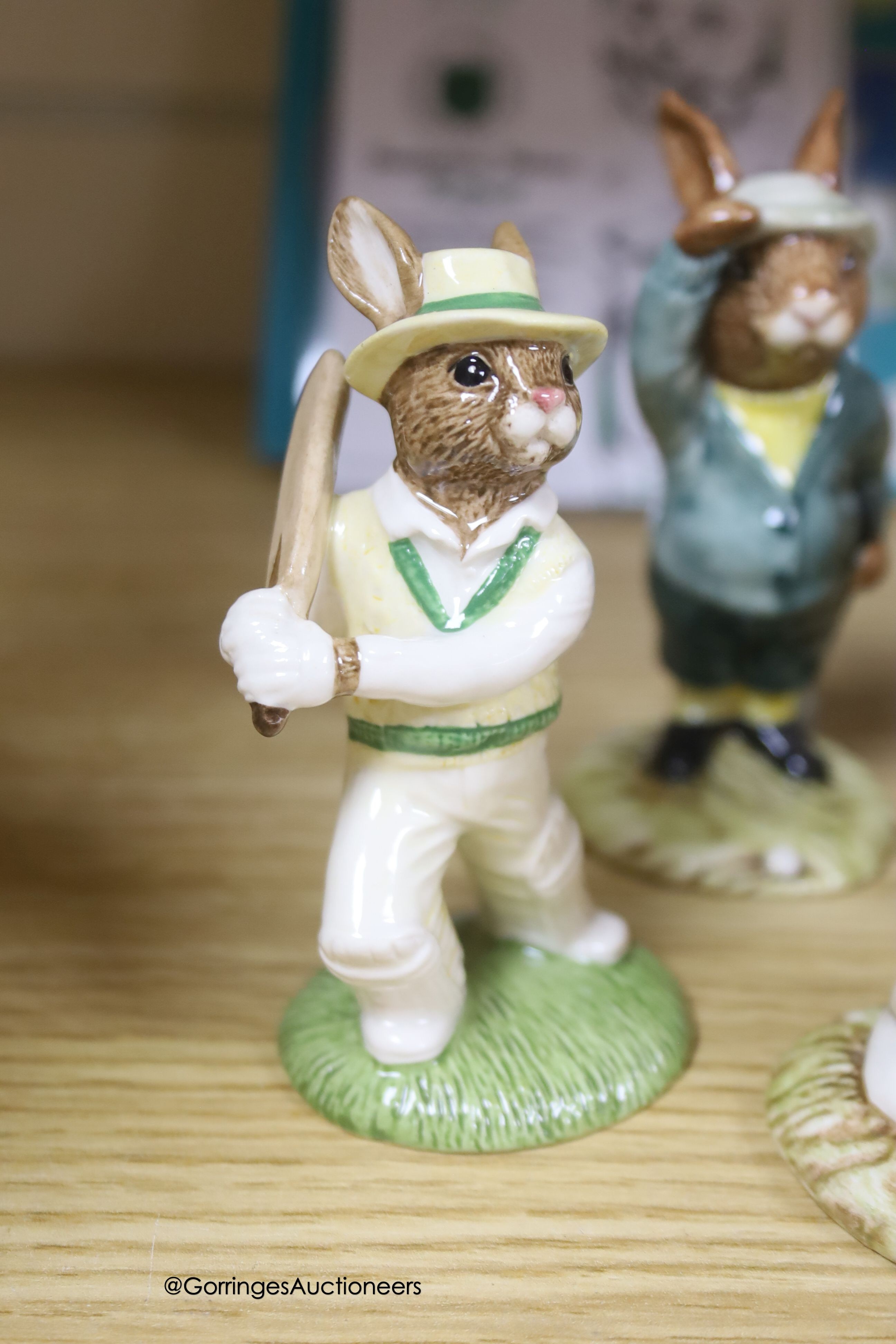 Seven Royal Doulton Bunnykins figures, sporting figures and two Royal Doulton sporting figures, tallest 15cm